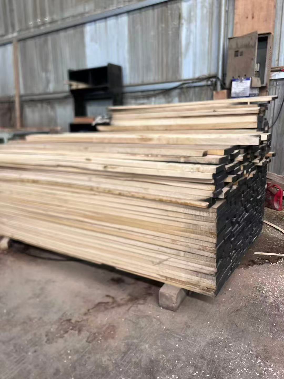 Solid wood boards stored in the workshop